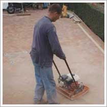 Compact the block paving with vibrating plate
